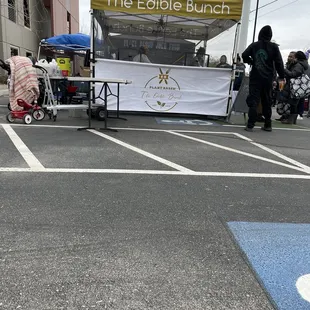 a table with food on it in a parking lot