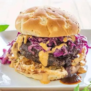 Bunches BBQ Burger w/ fresh fried onions, black bean patty, Cajun Cole slaw,  &amp; Our homemade cashew cheese and BBQ sauce