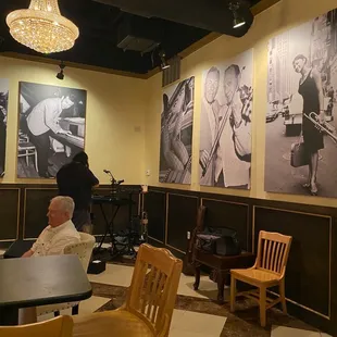 a man sitting at a table in a restaurant