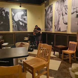 a man sitting at a table in a restaurant