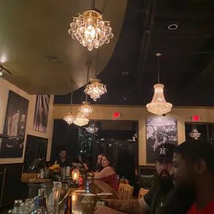 a group of people sitting at a bar