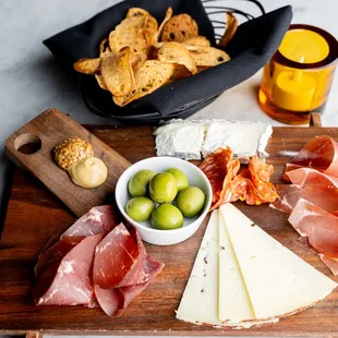 Charcuterie board with homemade bread crisps