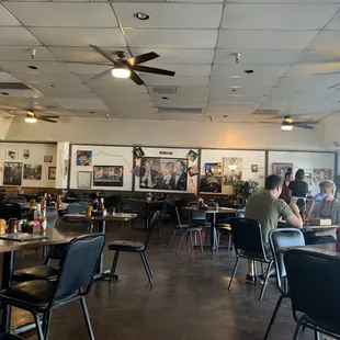 people sitting at tables in a restaurant