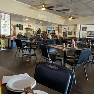 a restaurant with tables and chairs