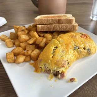 Everything omelette with breakfast potatoes, and sourdough bread