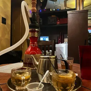 a hookah and cups of tea