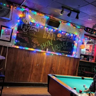 a billiards table in the foreground