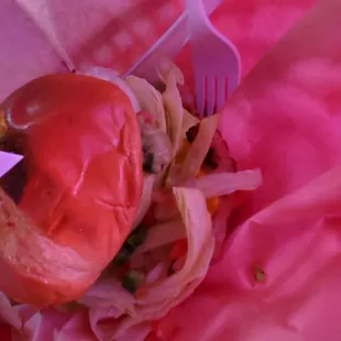 a hot dog in a wrapper