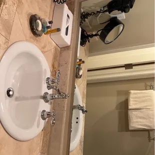Hairdryer, make up mirror, Q-tips and cotton pads provided.