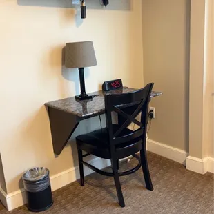 Additional TV and desk area in room with bed