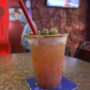 a drink with olives in it