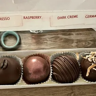 The six truffles available arranged in a box.