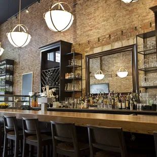a bar with a brick wall