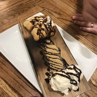 a desert with ice cream and chocolate sauce