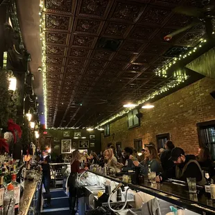 a crowded bar with lots of people