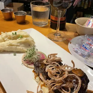 Steak special, onion straws and mashed... classic, with a bottle of Bonanza!