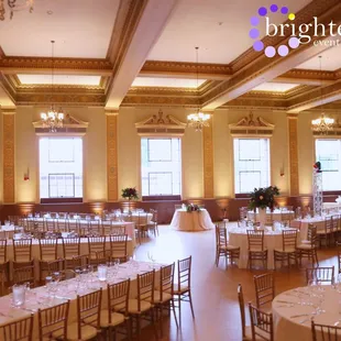 Soft Gold Uplighting at the beautiful Elks Tower Event Center. Uplighting by www.brightenuplighting.com