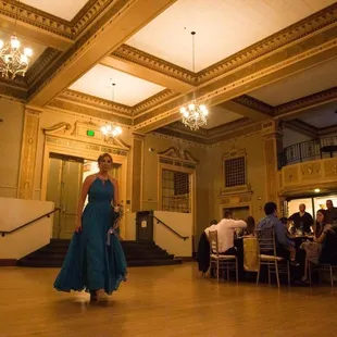 Bridesmaid being introduced into the reception ballroom