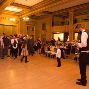 My husband about to shoot the garter with a rubber band gun