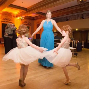 Bridesmaid and twin flower girl getting their dance on
