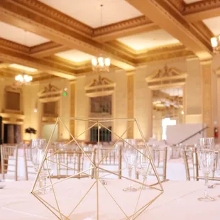 Soft Gold Uplighting at the beautiful Elks Tower Event Center. Uplighting by www.brightenuplighting.com