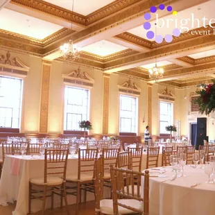 Soft Gold Uplighting at the beautiful Elks Tower Event Center. Uplighting by www.brightenuplighting.com