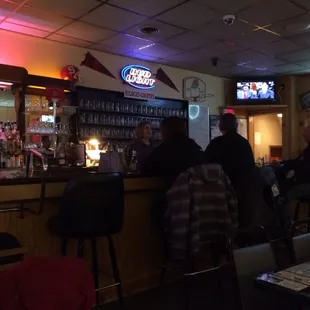 people sitting at a bar
