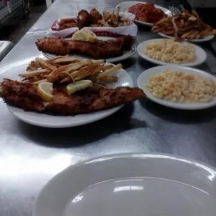 Fish dinner with mac and cheese meatball splash with frnch fries