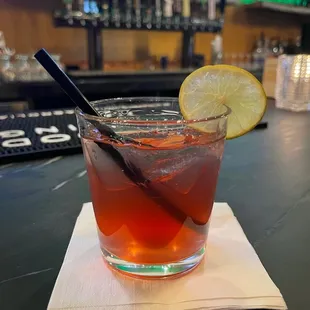 a glass of tea with a slice of lemon