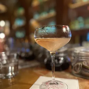 a glass of wine on a napkin