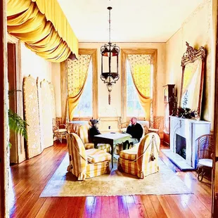 a man sitting at a table in a living room