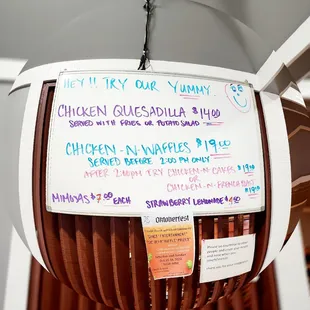 a sign on the ceiling of a restaurant