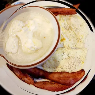 a plate of food with eggs and bacon