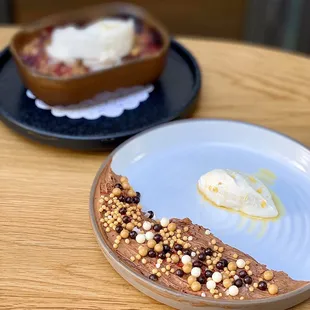 Valrhona Manjari Mousse w/ crunchy things | $8 (Background: Farmer&apos;s Market Berry Crisp w/ vanilla ice cream-$12)