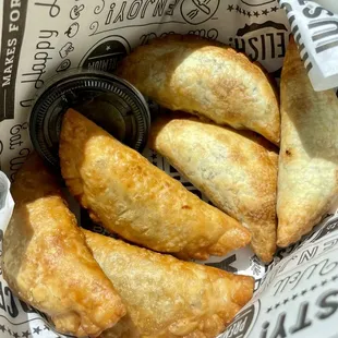 Half deep fried, and half baked beef and chicken empanadas!