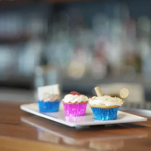 three cupcakes on a plate