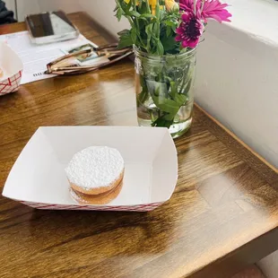 Alfajor-Argentine homemade cookie topped off with powered sugar, filled with dulce de leche(milk caramel)