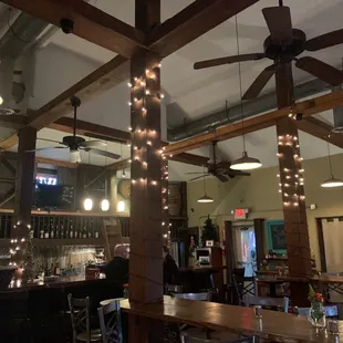 a bar with a ceiling fan