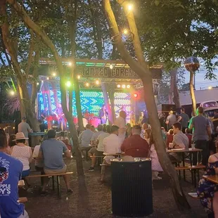 a large group of people sitting at tables