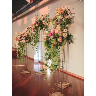 Columns with floral arrangements