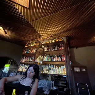 a woman sitting at a bar