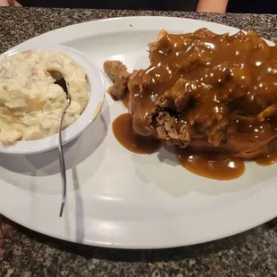 Open faced roast beef sandwich with potato salad