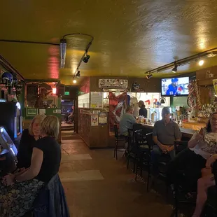 This is the view when you enter. Bar on the right, music room to the left and bathrooms and patio at the far end.