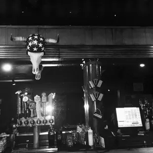 a cow skull hanging from the ceiling
