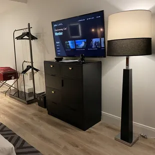 Entertainment center. A mini fridge inside the cabinetry. Sadly, no microwave.