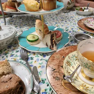 a table full of tea and pastries