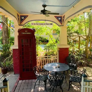 a table and chairs on the porch