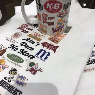 Ain't Dere No More mugs and tea towels - just a few of the fun gifts we carry in store!