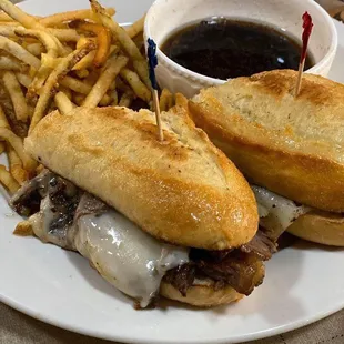 Prime rib French dip sandwich and fries.