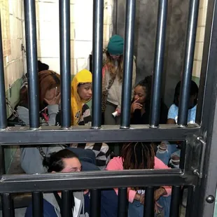 We got out but she still took photos of us all in booking LOL